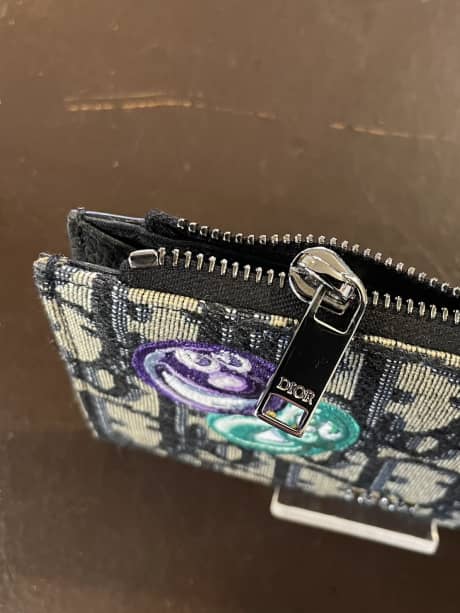 CHRISTIAN DIOR（クリスチャンディオール）フラグメントケース　ファスナー下留め金具取付け | 革小物修理