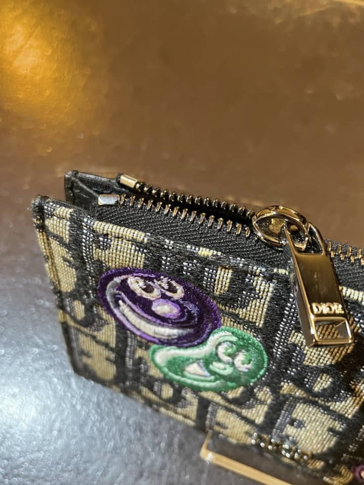 CHRISTIAN DIOR（クリスチャンディオール）フラグメントケース　ファスナー下留め金具取付け | 革小物修理